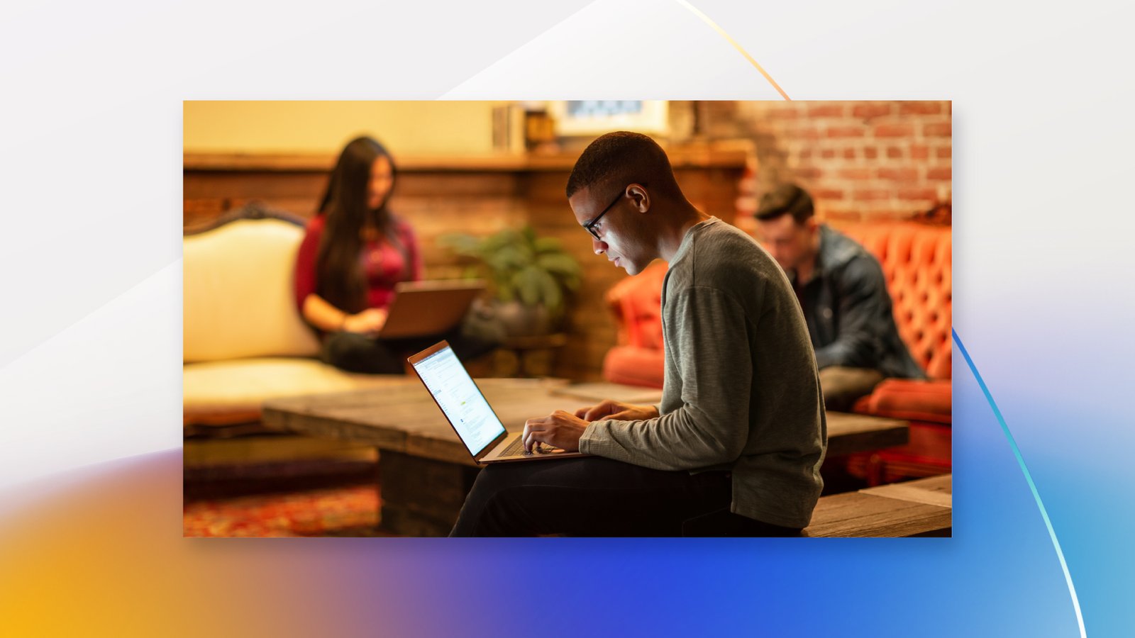Male developer working remotely from a cafe.