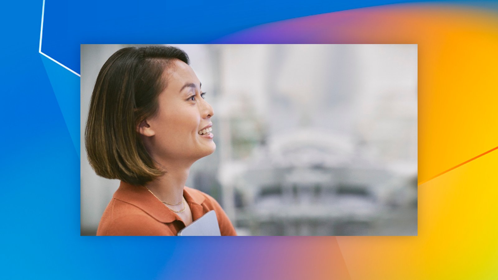 A woman looking off to the side with a smile